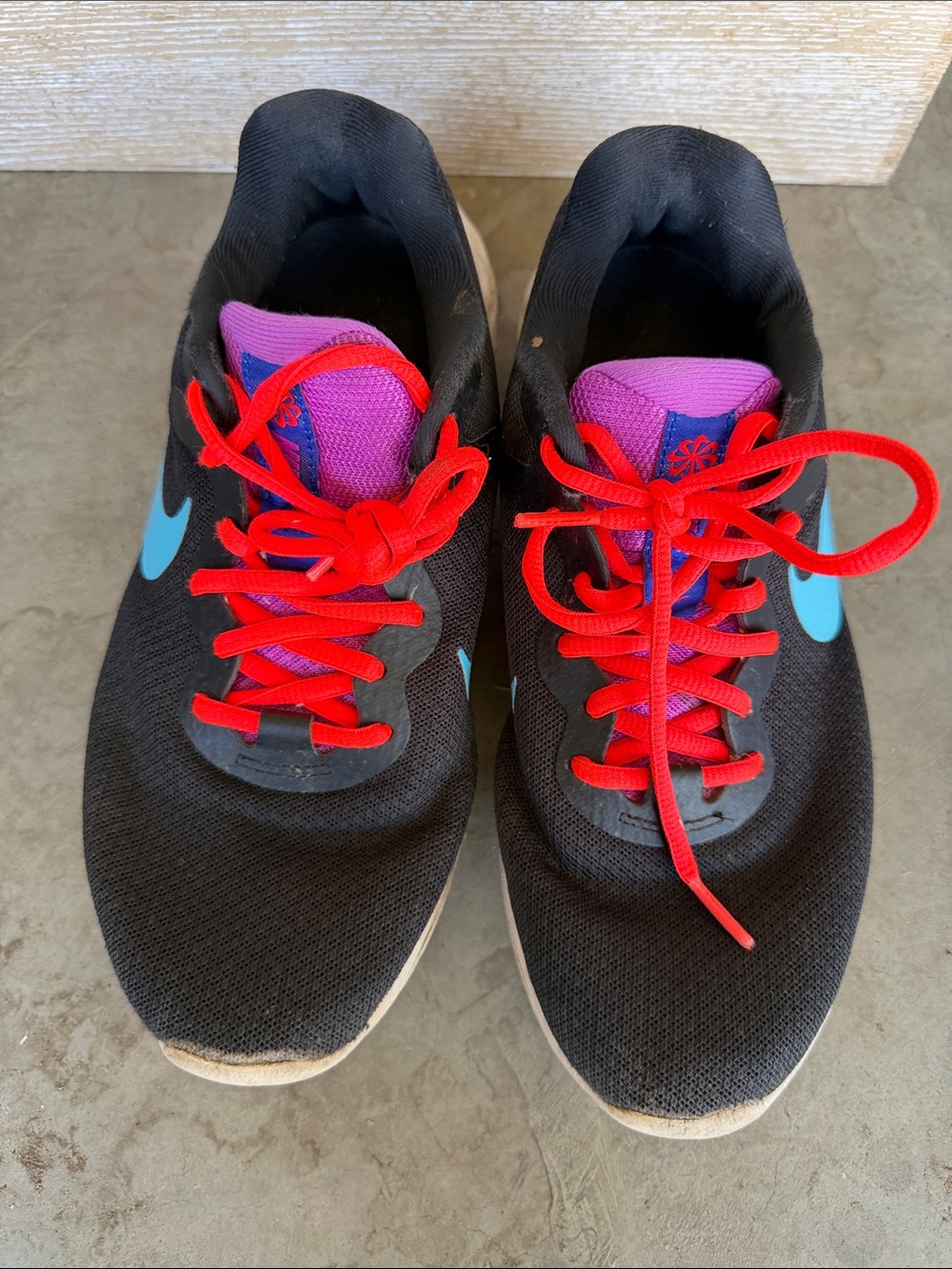 Nike Women's Black Athletic Shoes with Teal Swoosh and Red Laces